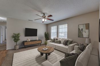 Living room with modern furnishings and ceiling fan
